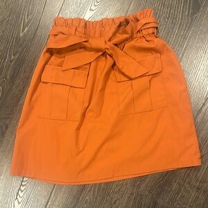 Kancy Kole mini skirt with front pockets and bow tie 🎀🧡